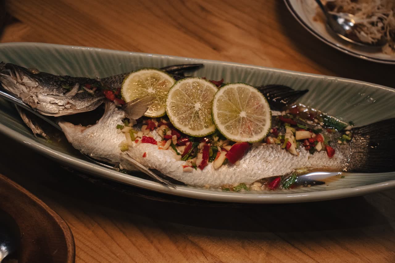A whole steamed fish with lime, ginger and scallion