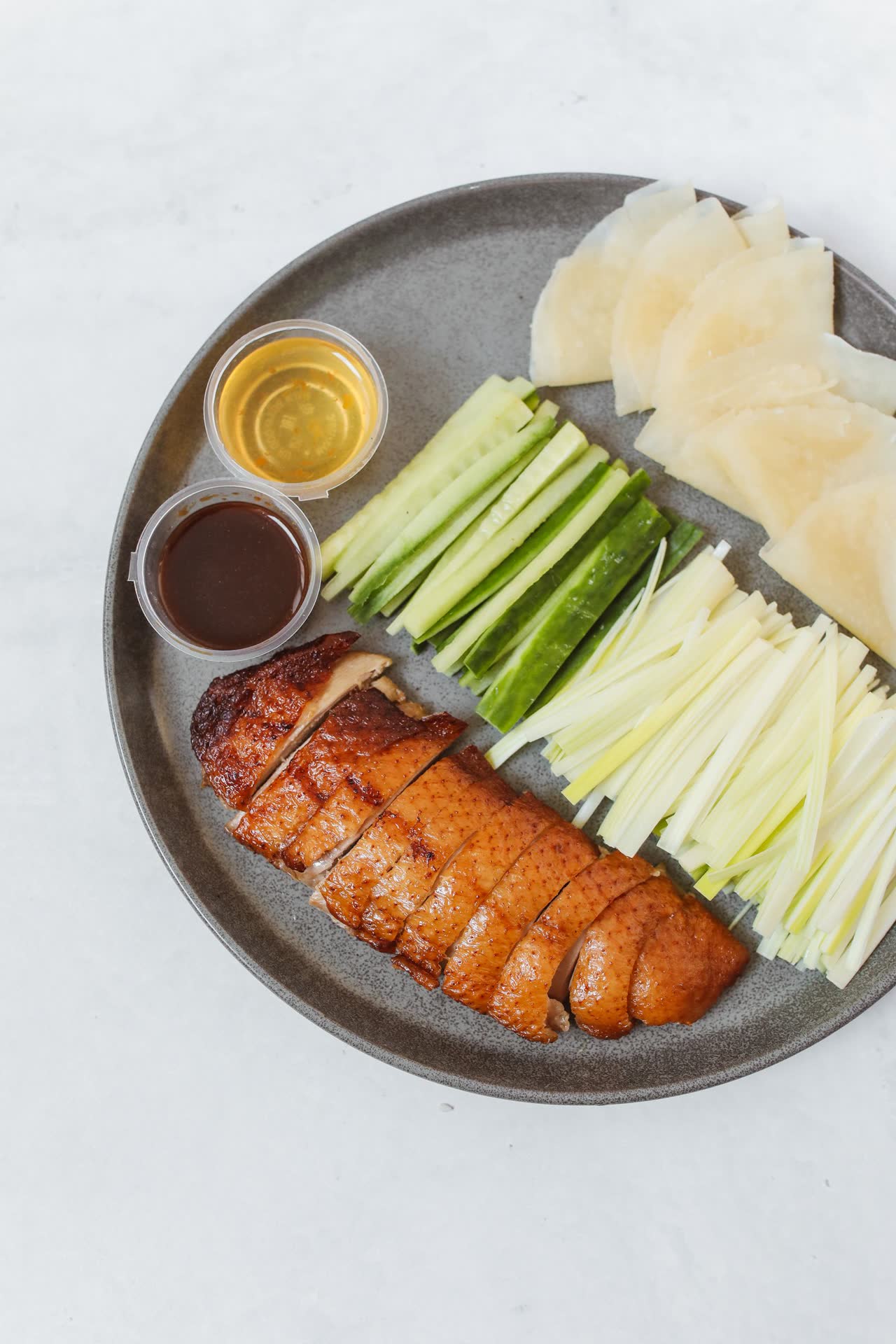 Peking duck sliced with steamed buns